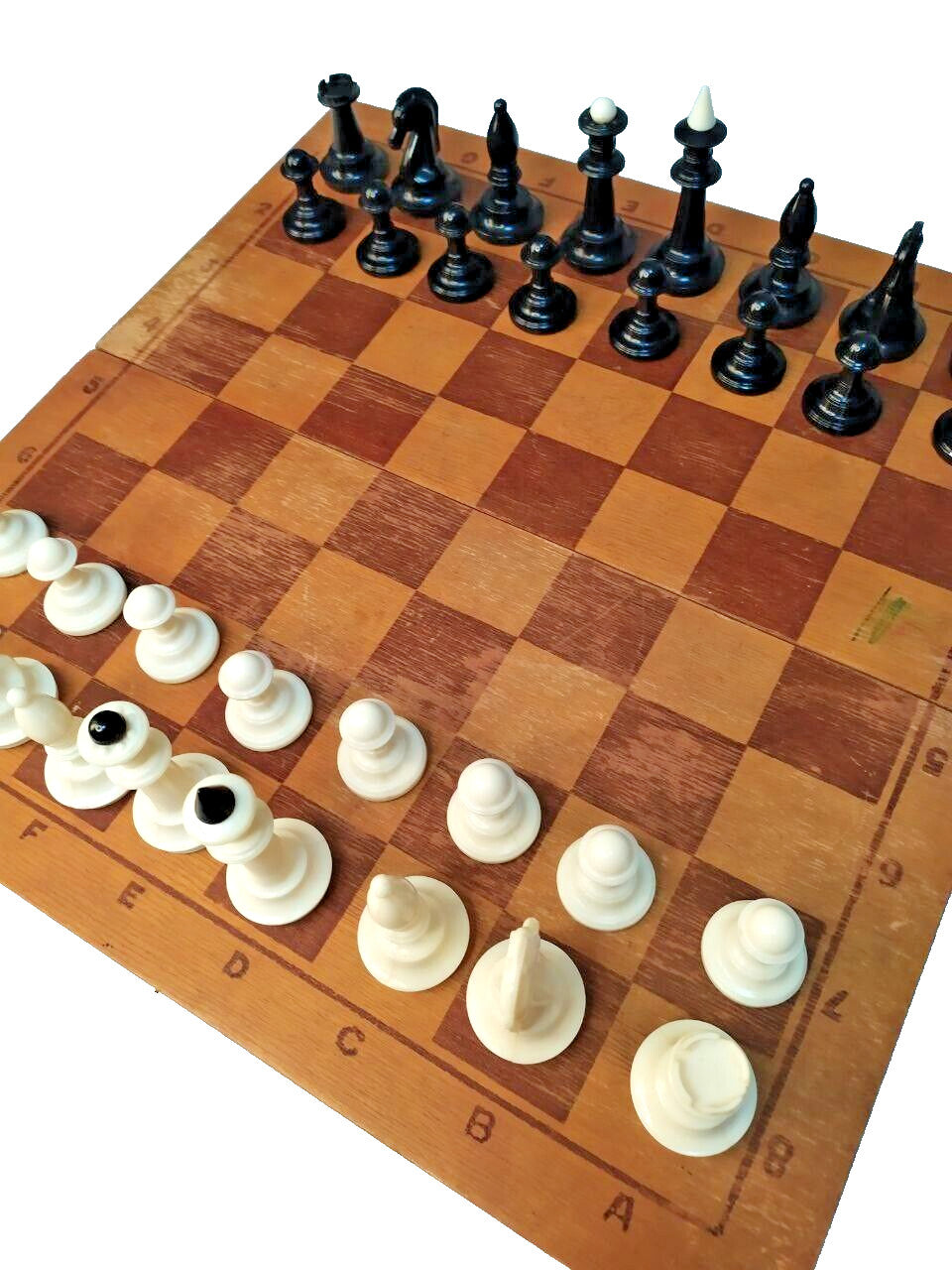 Folding Soviet chess board open with internal storage for the pieces