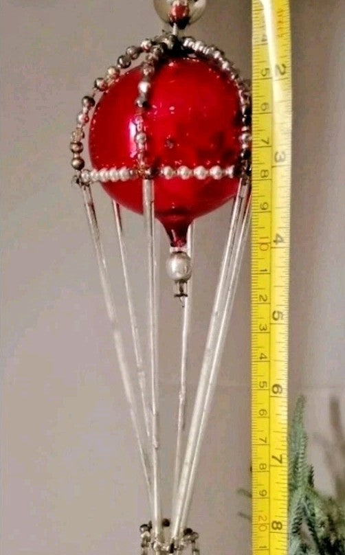 Russian Christmas ornament with glass rods and a small wicker-style basket