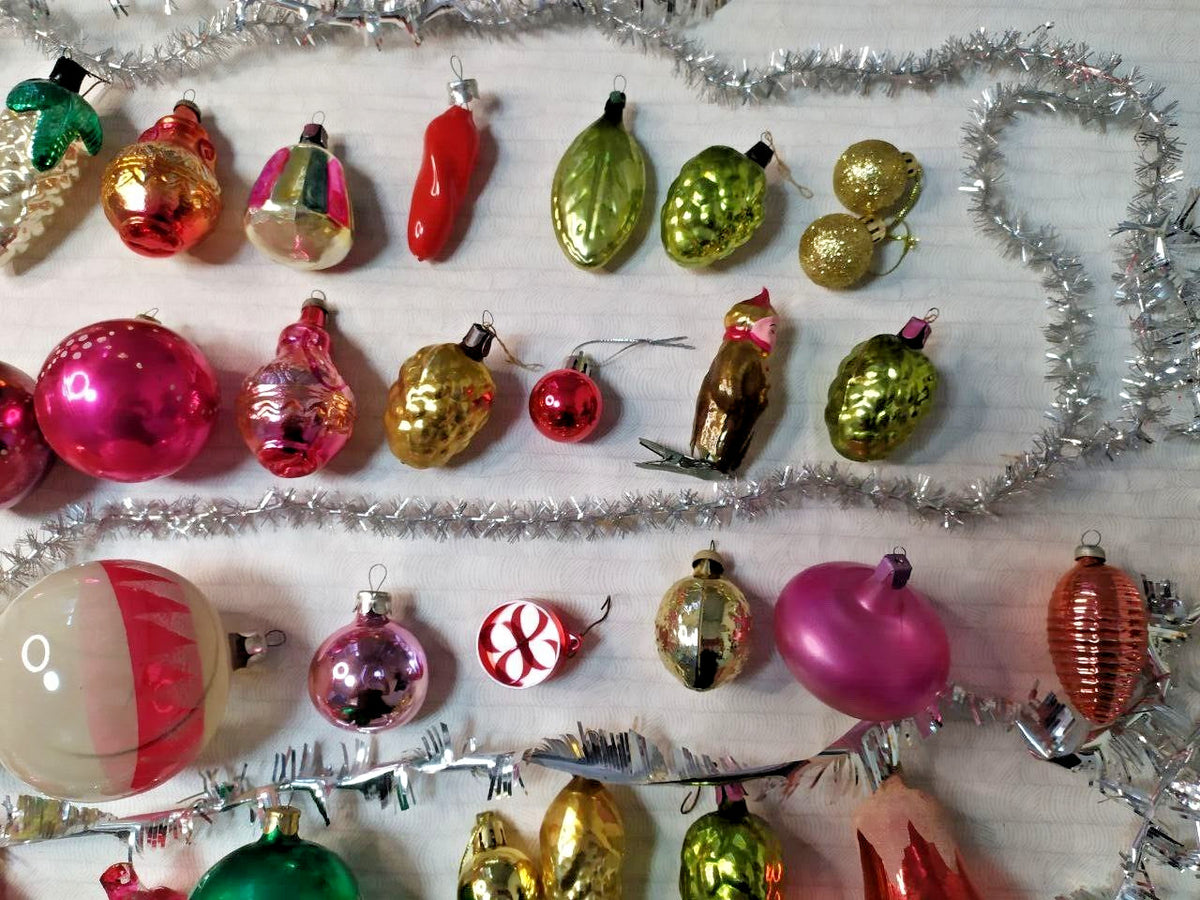 Vintage Soviet Christmas ornaments laid out, showing shapes and colors