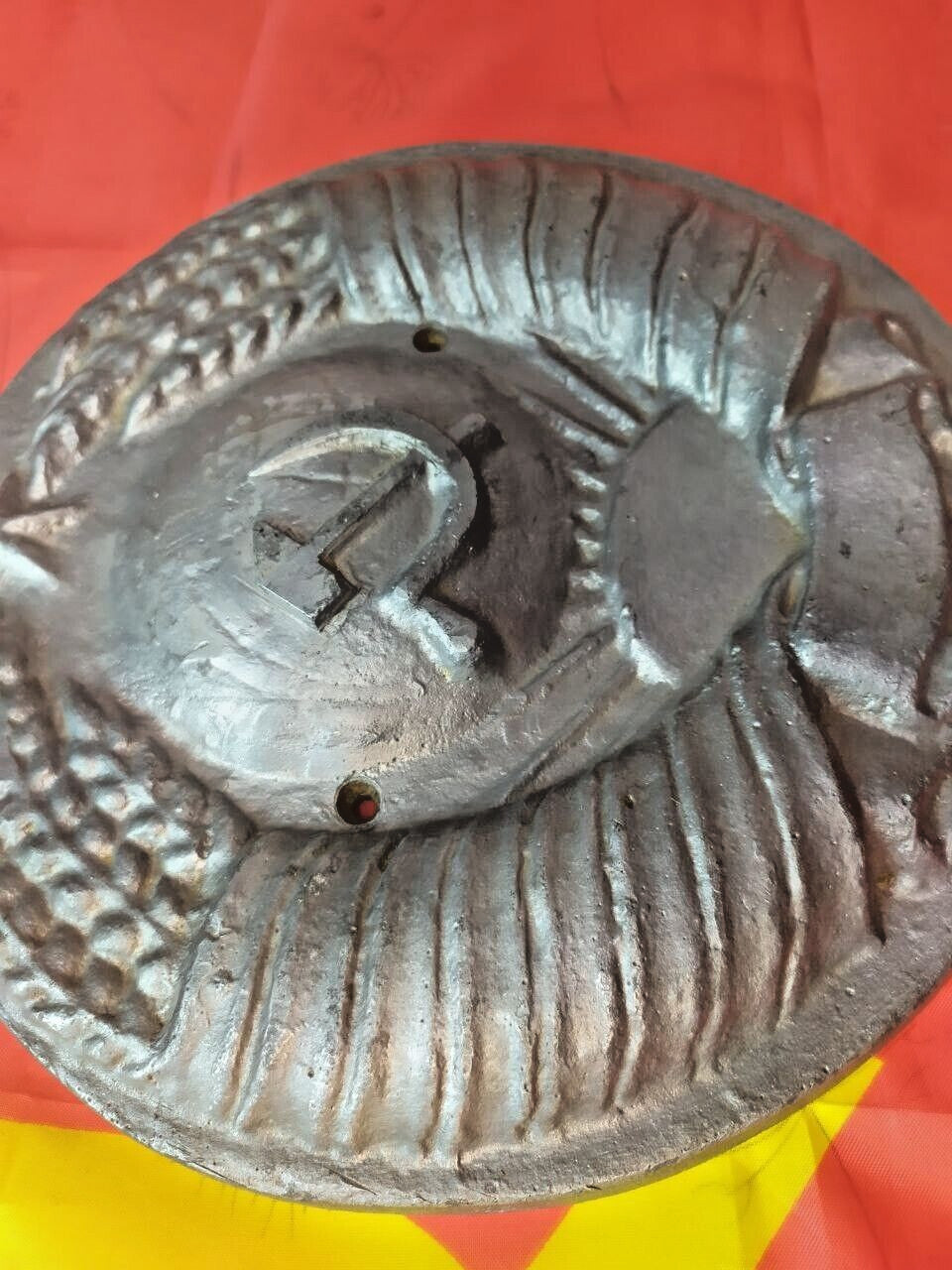 Hammer and sickle wall sign from the Soviet Union with aged patina