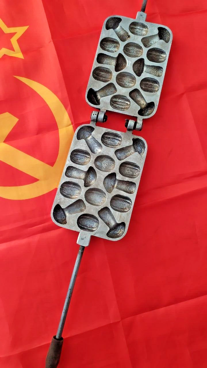 Soviet cookie mold in heavy cast aluminum with mushroom and walnut shapes and long handles
