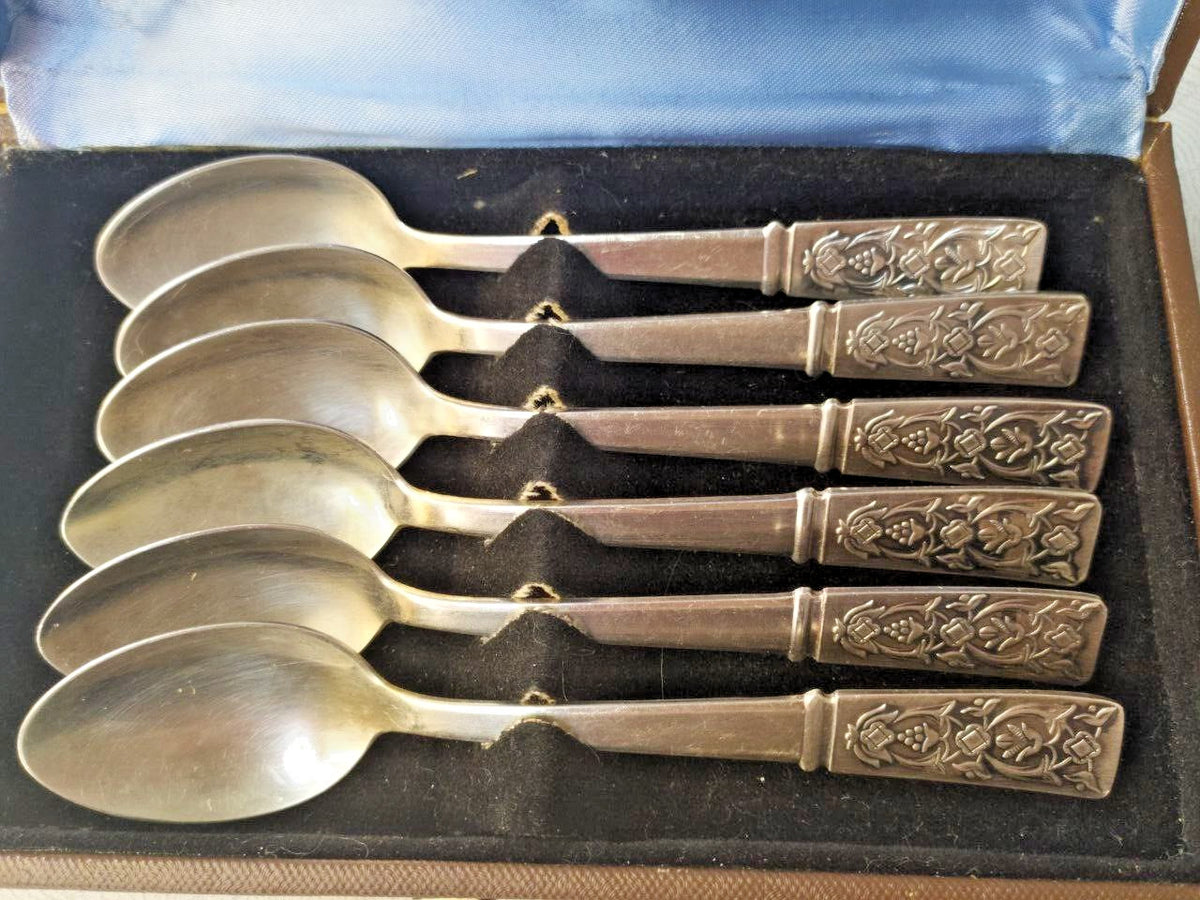 Vintage Soviet melchior spoons with rich floral relief handles