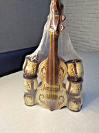Violin decanter in cream with dark brown floral and scroll pattern