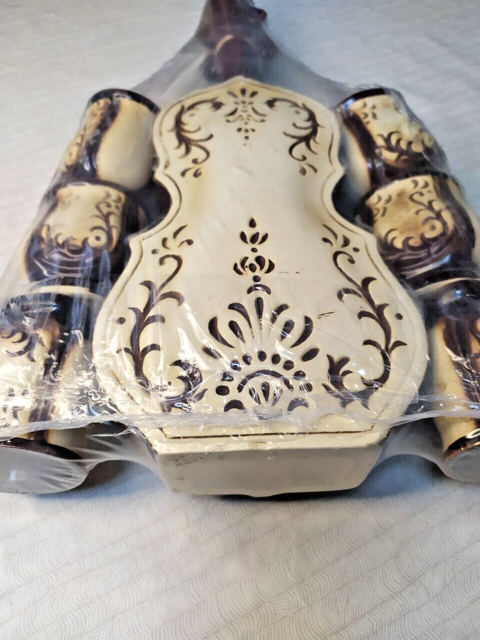 Ceramic decanter with cups fitted around the sides of the violin body – detail 9