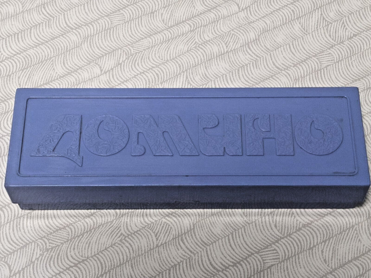 Vintage Soviet dominoes with white dots on black tiles