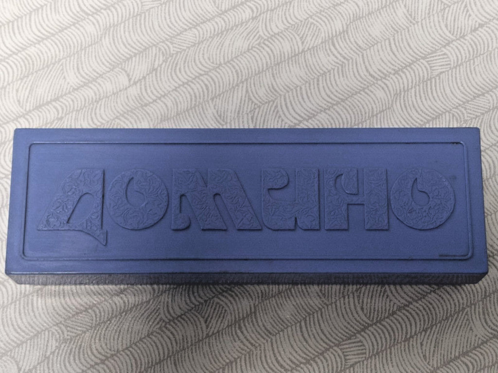 Bottom of Soviet domino case with factory stamps and price in rubles