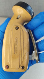 Soviet dynamo flashlight Zhuk with metal squeeze lever and ZEMZ logo