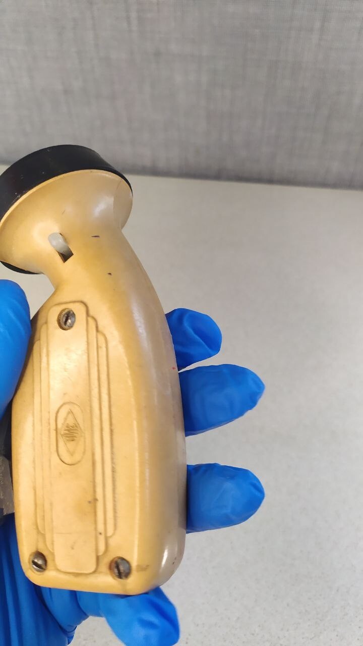 Vintage Soviet flashlight bulb lit by squeezing the dynamo lever