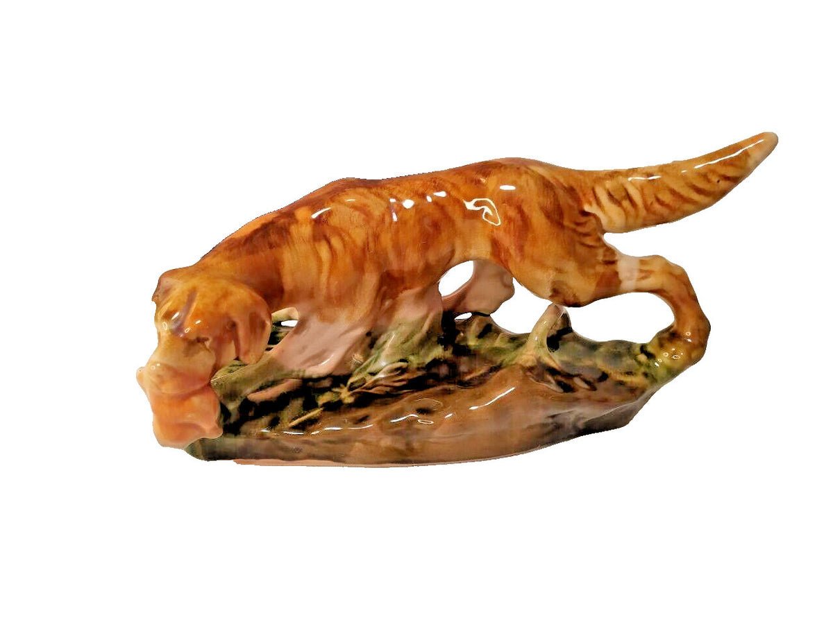 Unglazed red clay base of the vintage Soviet faience dog figurine