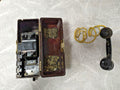 Soviet field telephone TAI-43 in dark brown Bakelite case with black handset and yellow braided cord
