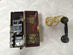 Soviet field telephone TAI-43 in dark brown Bakelite case with black handset and yellow braided cord