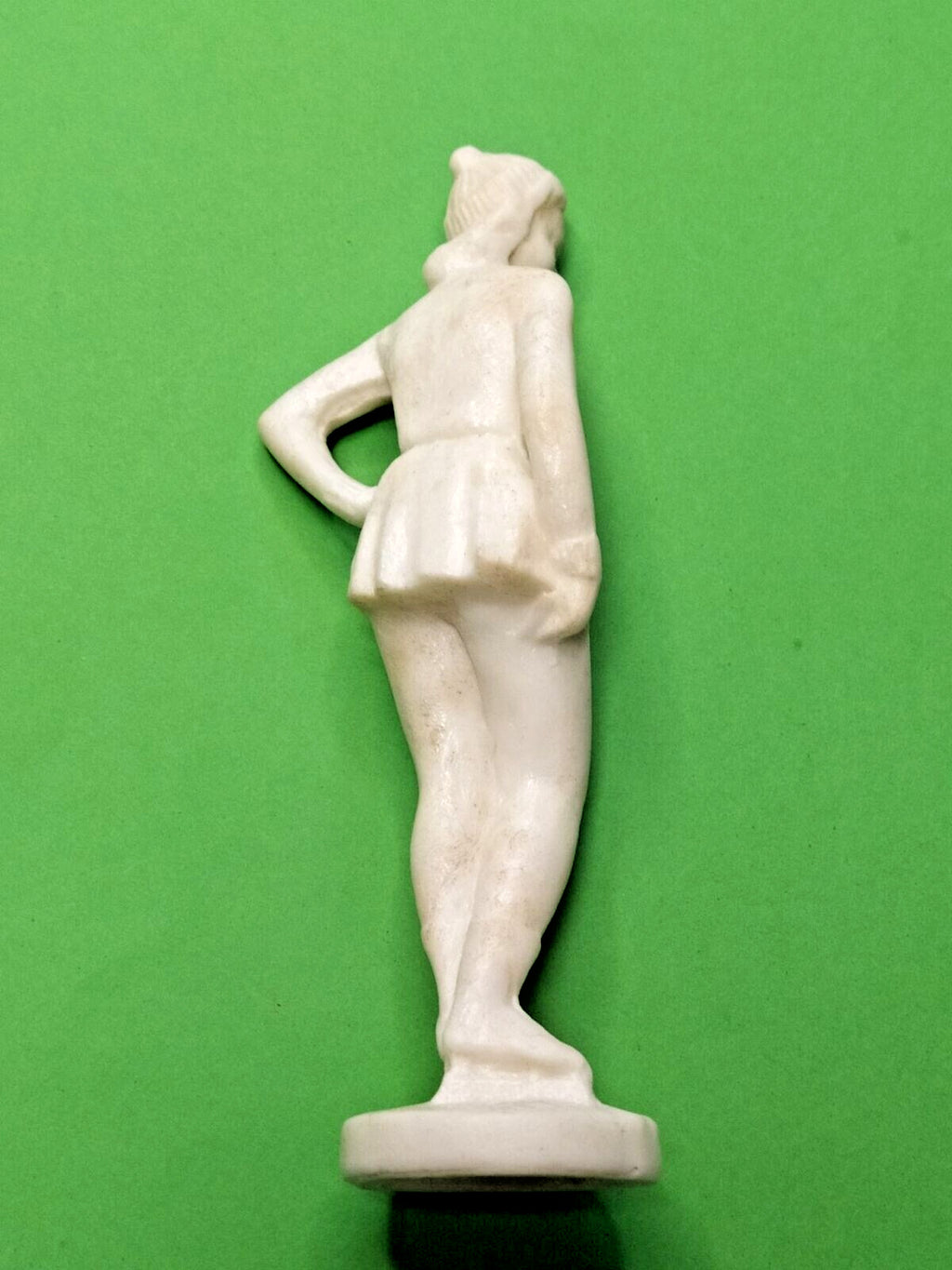Soviet plastic figurine surface texture close-up