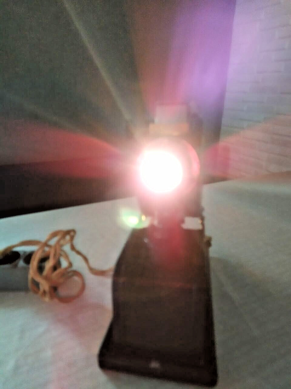 Vintage slide projector from the 1950s USSR with lamp lit during testing – detail 11