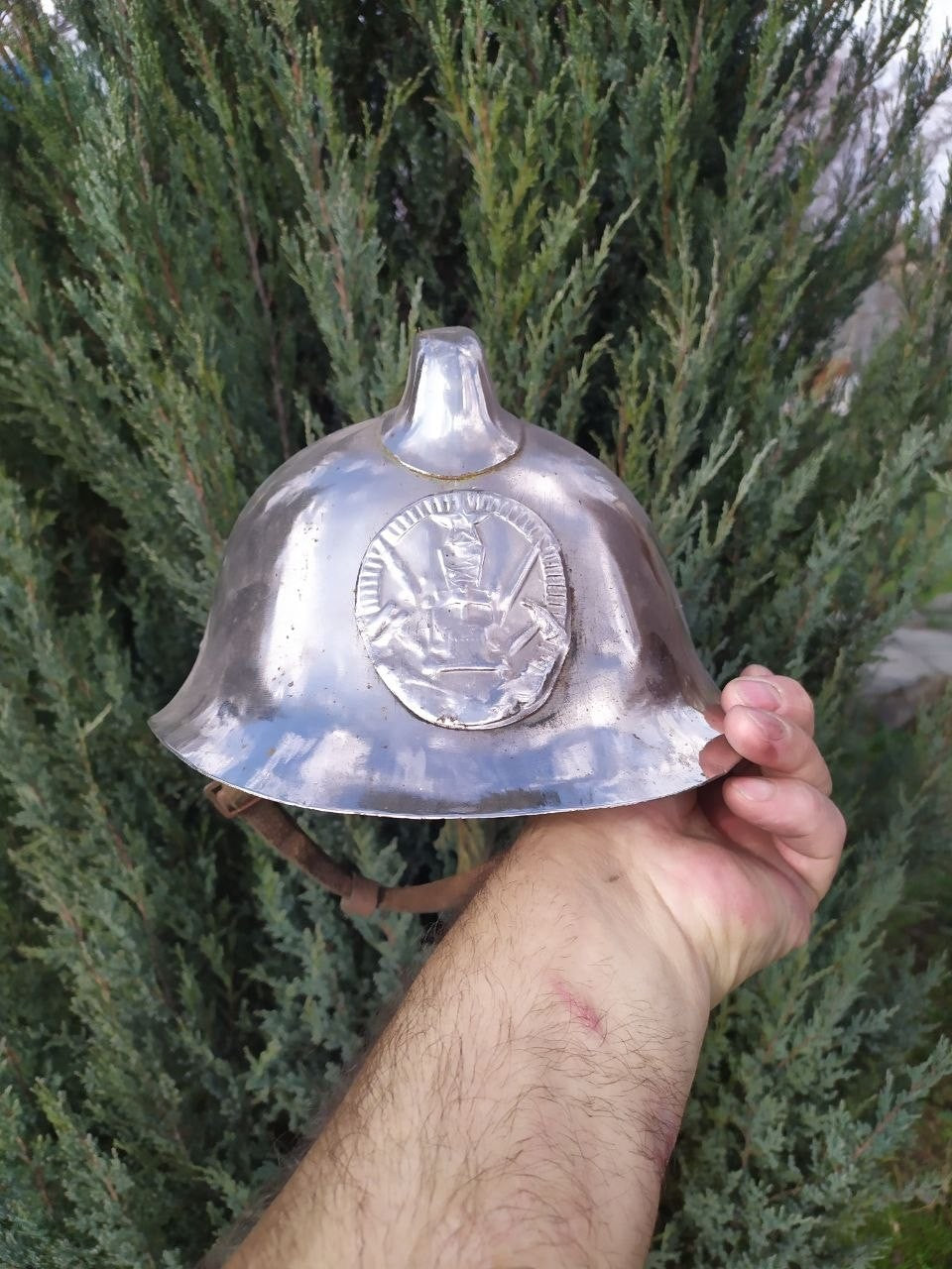 Original leather liner and chin strap inside the Soviet fireman helmet