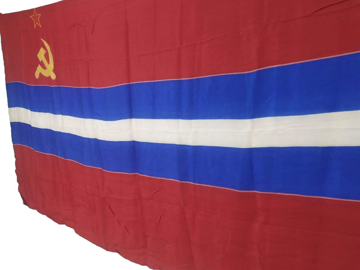 Gold hammer and sickle with red star on the USSR flag with blue stripe