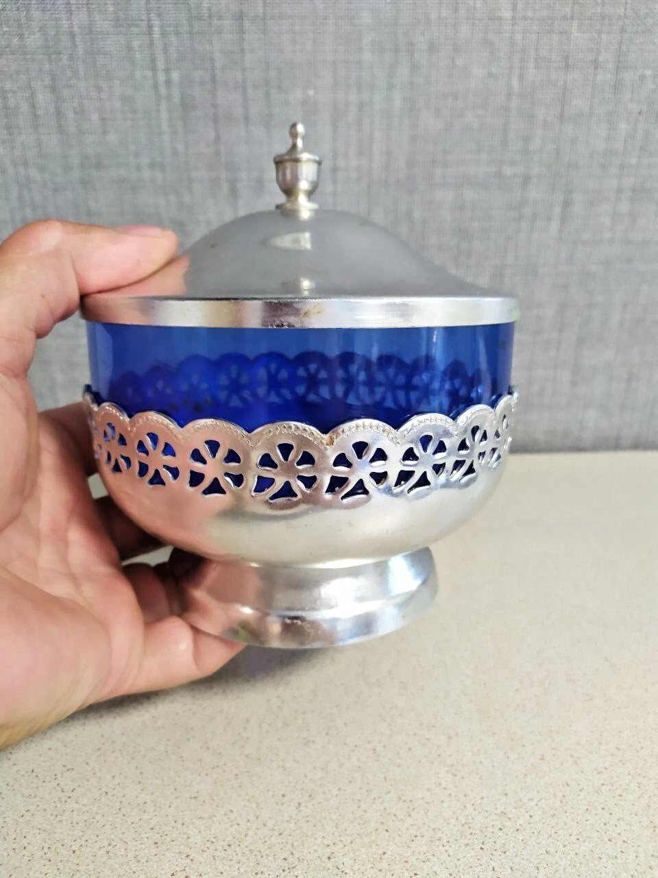 Cobalt blue sugar bowl with openwork silver-tone metal holder and pedestal base