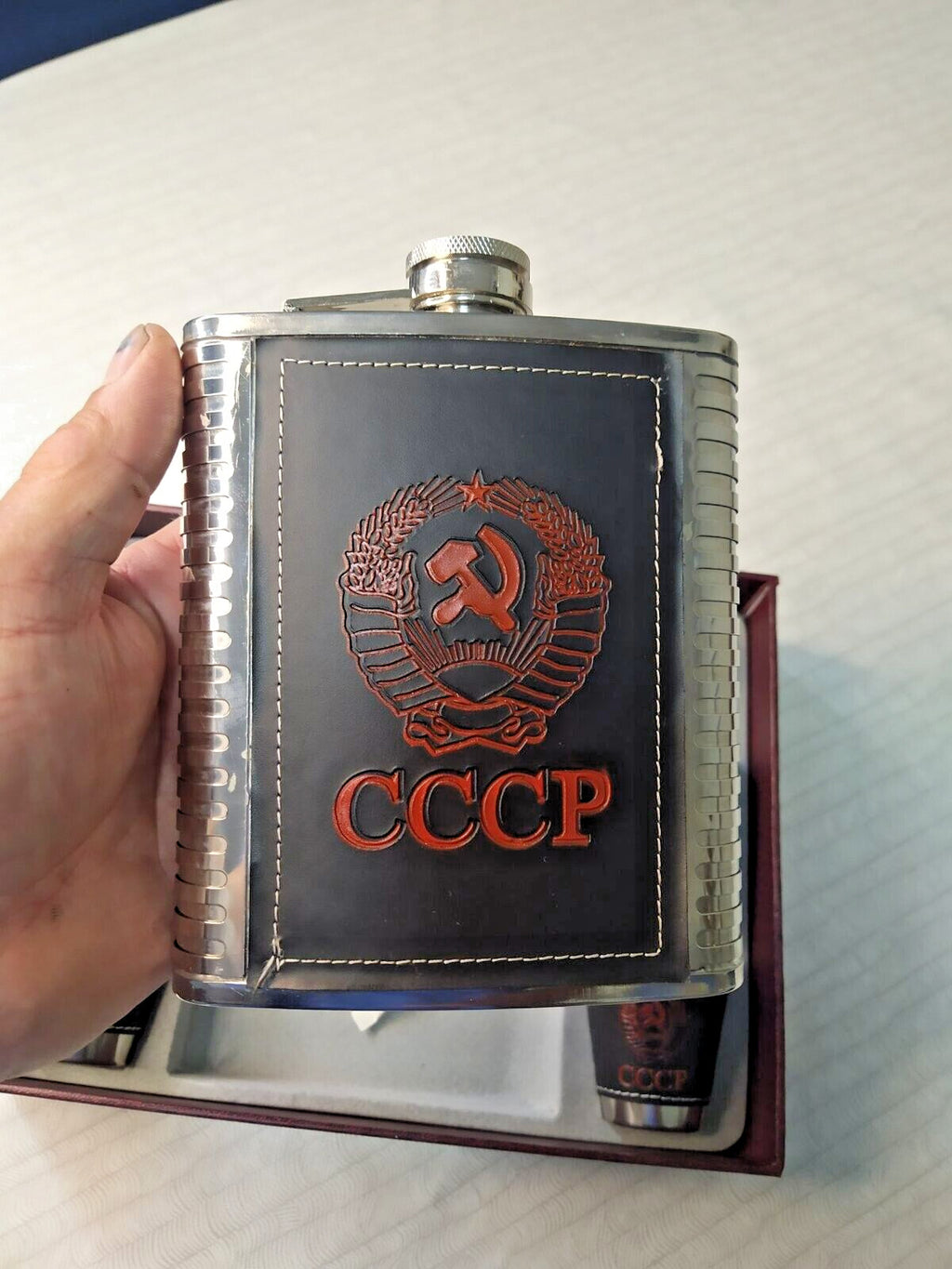Hammer and sickle emblem embossed on faux leather flask trim – detail 6