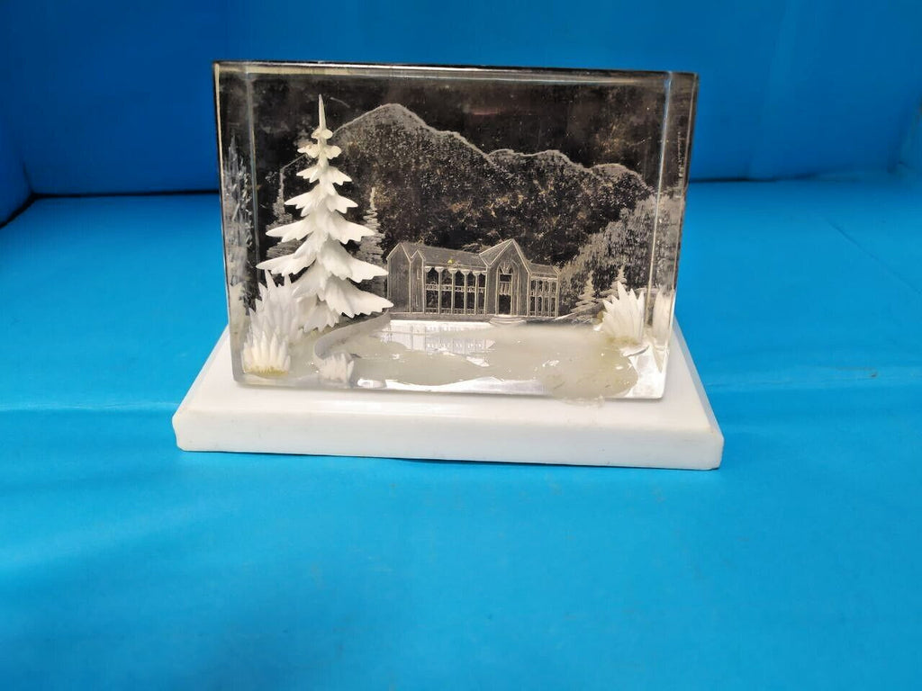 Vintage lucite winter scene with black rear background for contrast