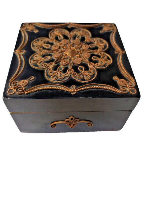 Filigree jewelry box open showing original red velvet lining