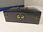 Gold-colored floral pattern under the lid of the Bakelite jewelry box