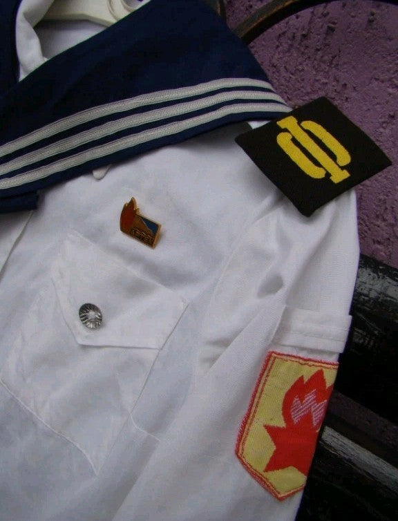 Soviet kids sailor uniform pieces laid out together