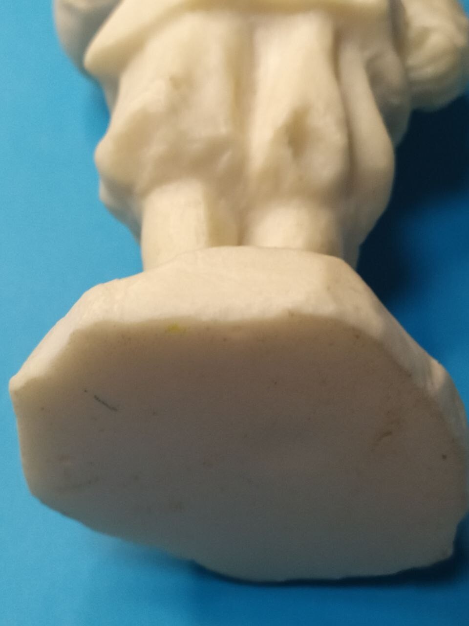 Young Lenin figurine shown next to a measuring tape – detail 7