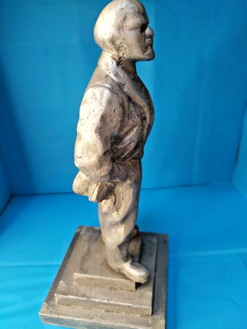Socialist realism metal figure with aged patina close-up