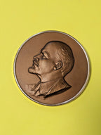 Soviet Lenin wall plaque with left-facing bas-relief profile and bronze-tone finish