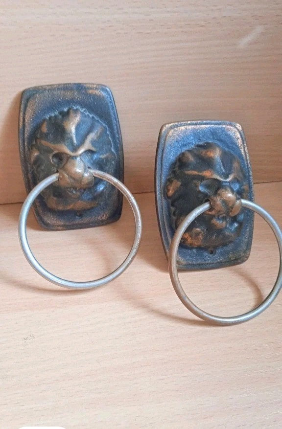 Pair of Soviet lion head door knocker handles in cast bronze/brass with rings