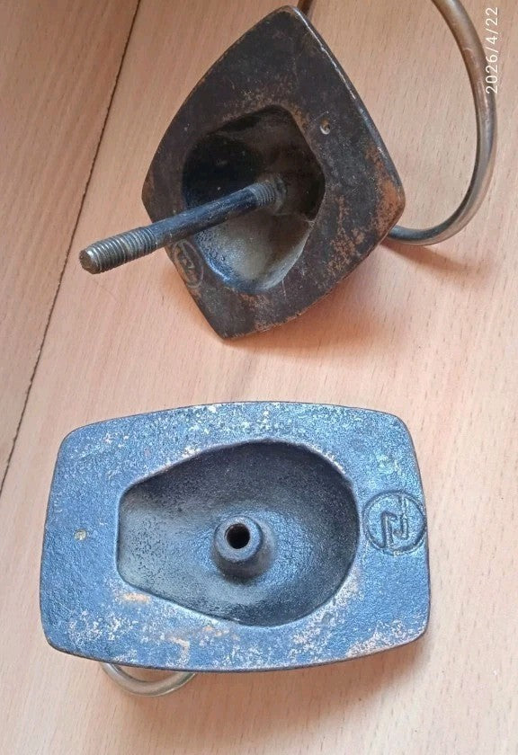 Maker's mark in a circle on the back of the bronze door knocker base – detail 6