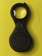 Folding pocket magnifier opened with clear glass lens swung out – detail 5