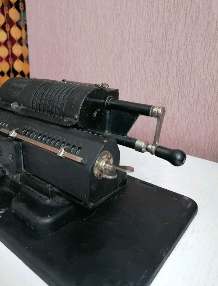 Levers, carriage and black textured paint of a Soviet arithmometer