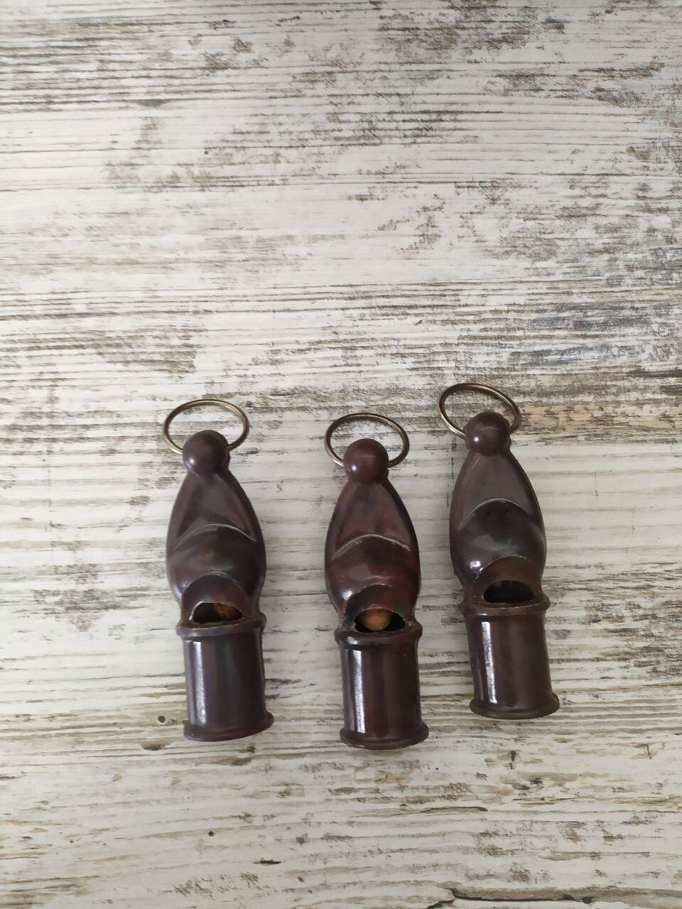 Red Army collectibles: three vintage USSR signal whistles side by side