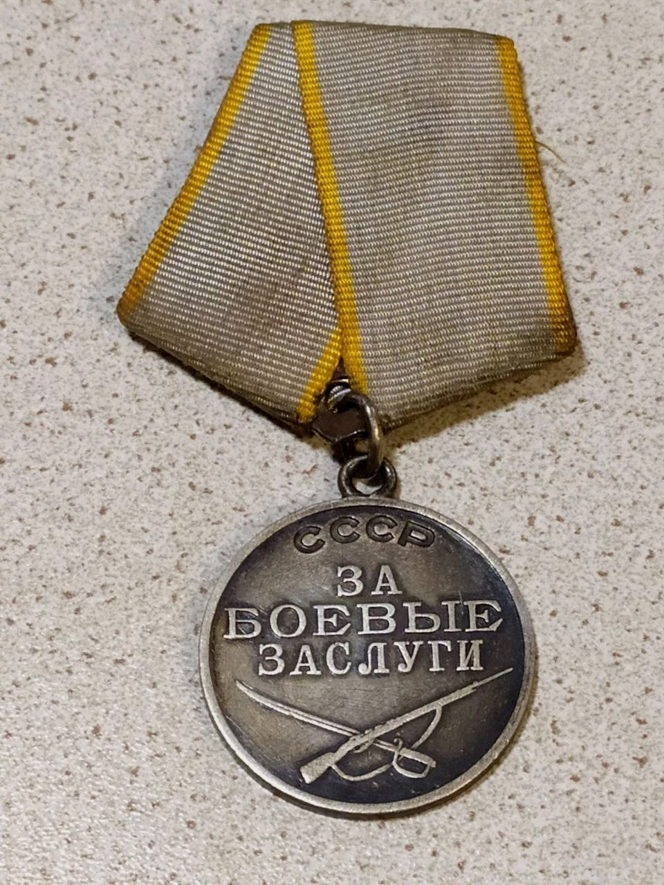 Original Soviet medal for military merit, close-up of the silver finish