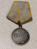 Original Soviet medal for military merit, close-up of the silver finish