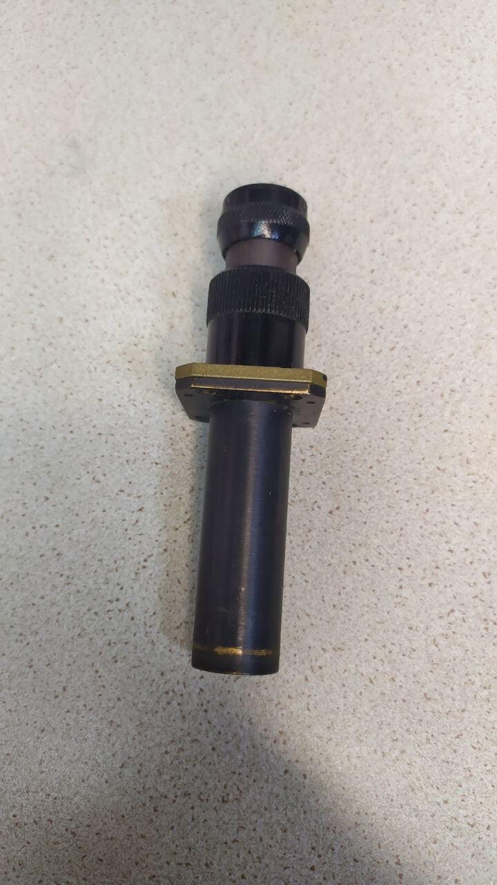 Soviet military optical sight with black enamel body, brass parts and mounting flange