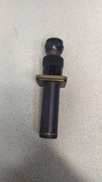 Soviet military optical sight with black enamel body, brass parts and mounting flange