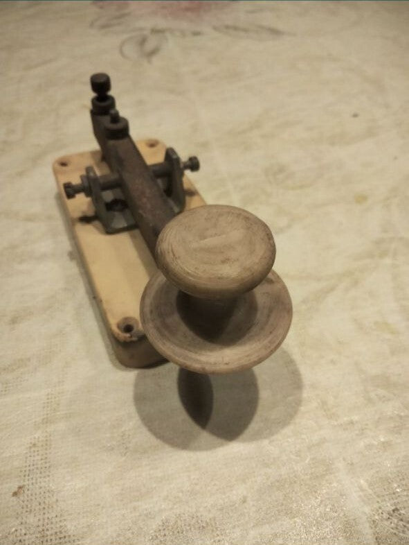 Vintage telegraph key with rimmed handle and adjustment screws