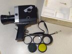 Set of four screw-in filters, lens hood and cable release in the box