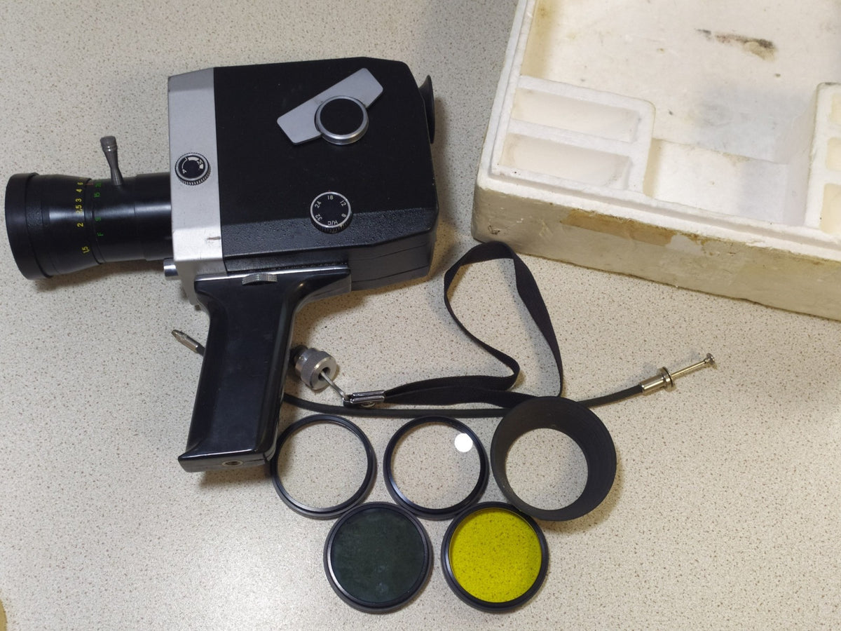 Set of four screw-in filters, lens hood and cable release in the box