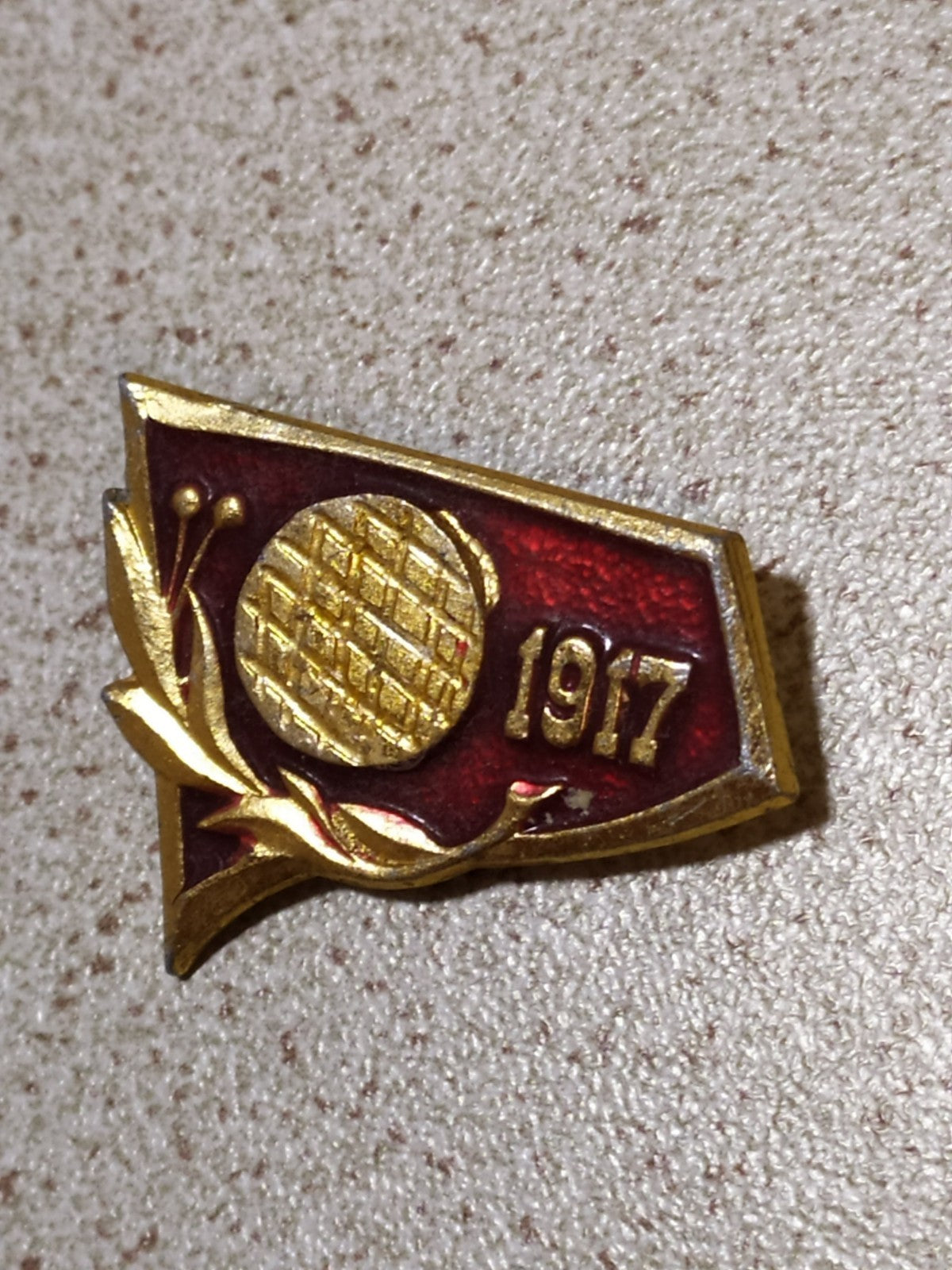 Soviet October Revolution pin with USSR flag and laurel wreath in enamel