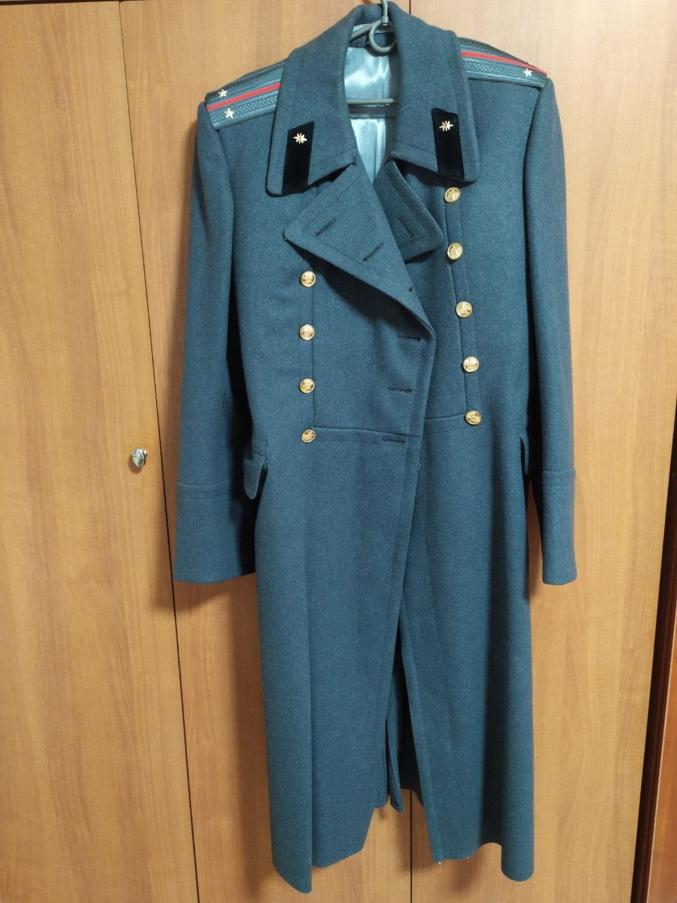 Soviet officer greatcoat in heavy steel-grey wool with shoulder boards and brass buttons