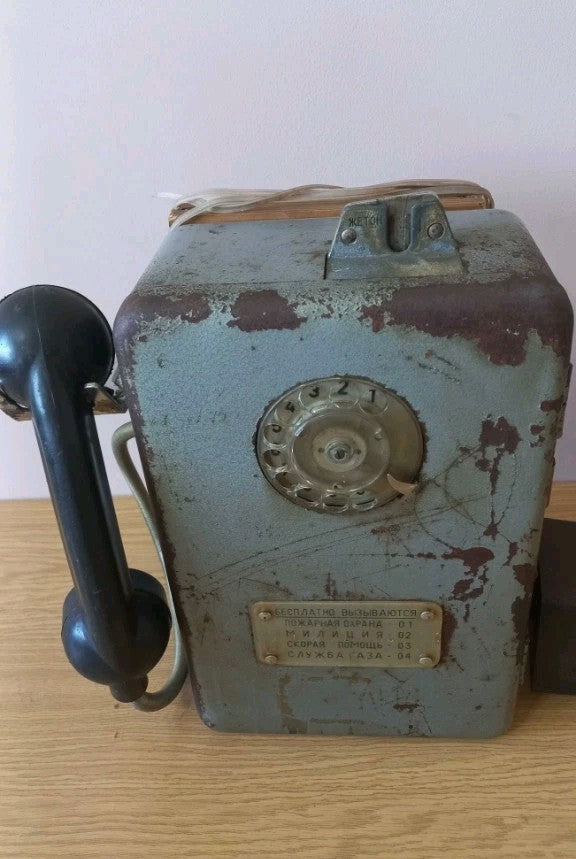 Cast iron AMT-47 coin phone with rust spots, patina and wooden mounting block