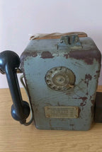 Cast iron AMT-47 coin phone with rust spots, patina and wooden mounting block