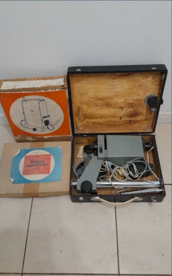 Soviet photo enlarger Don-103 with grey metal body and adjustable height column