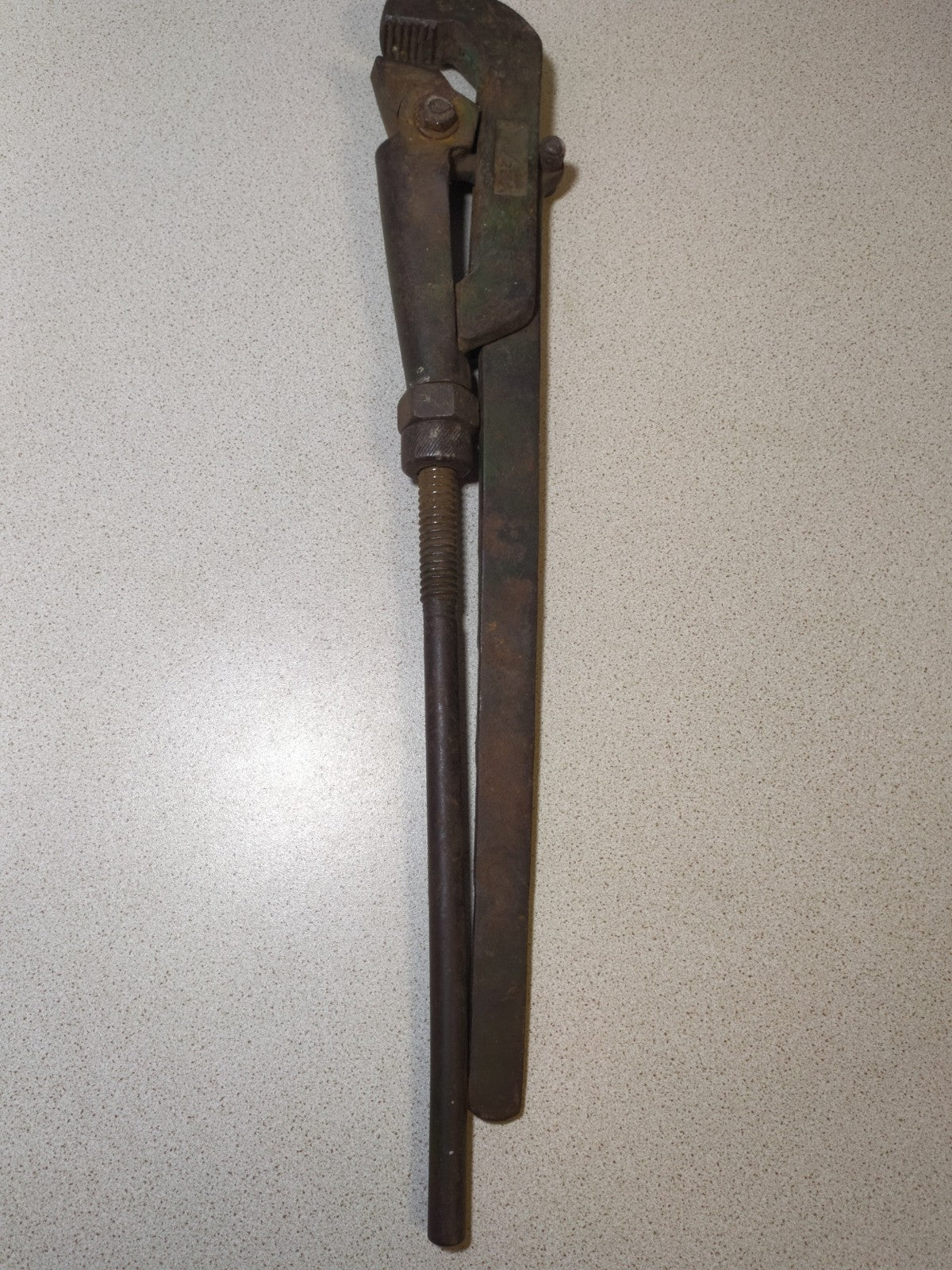 Adjustable pipe wrench made in USSR, close-up of the jaws and thread