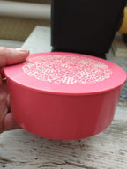 Soviet plastic jewelry box in pink with white floral and vine pattern on the lid