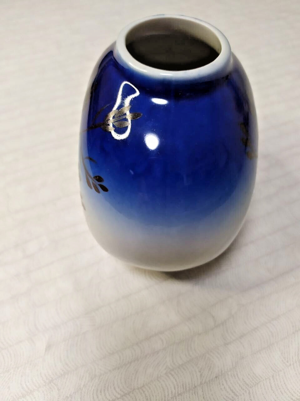 Miniature Soviet vase with spherical shape and gold grass motifs