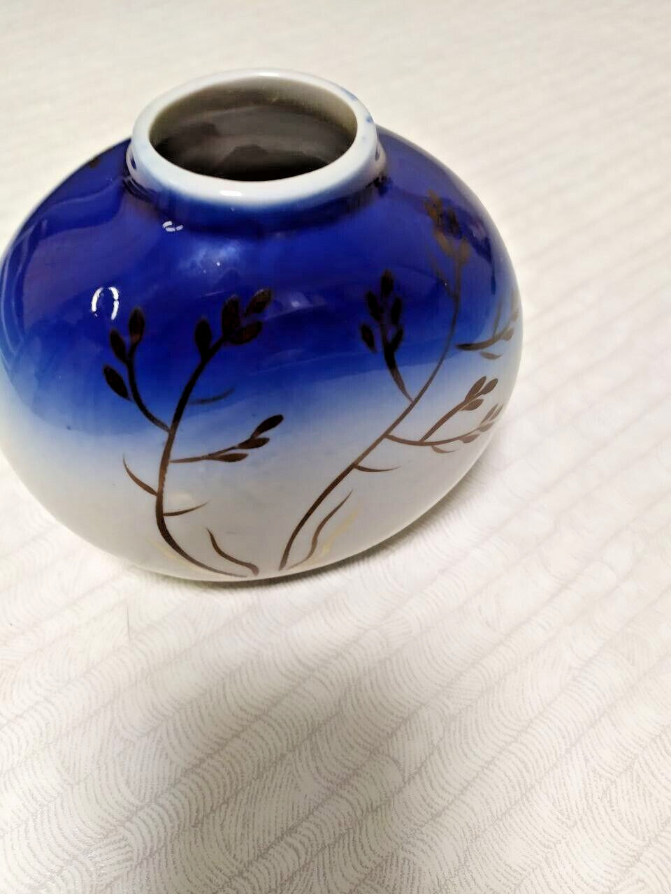 Cobalt blue to white gradient glaze on vintage porcelain vase