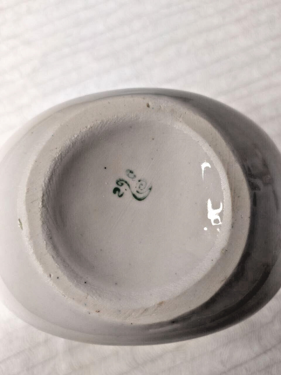 Green factory stamp on the bottom of a Soviet porcelain vase